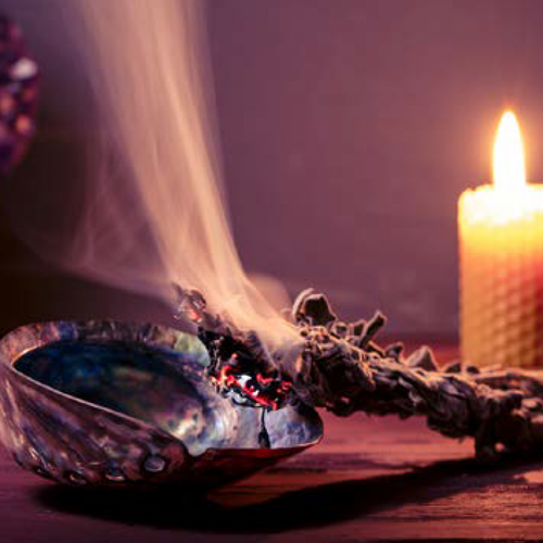 smudging stick with shell and candle